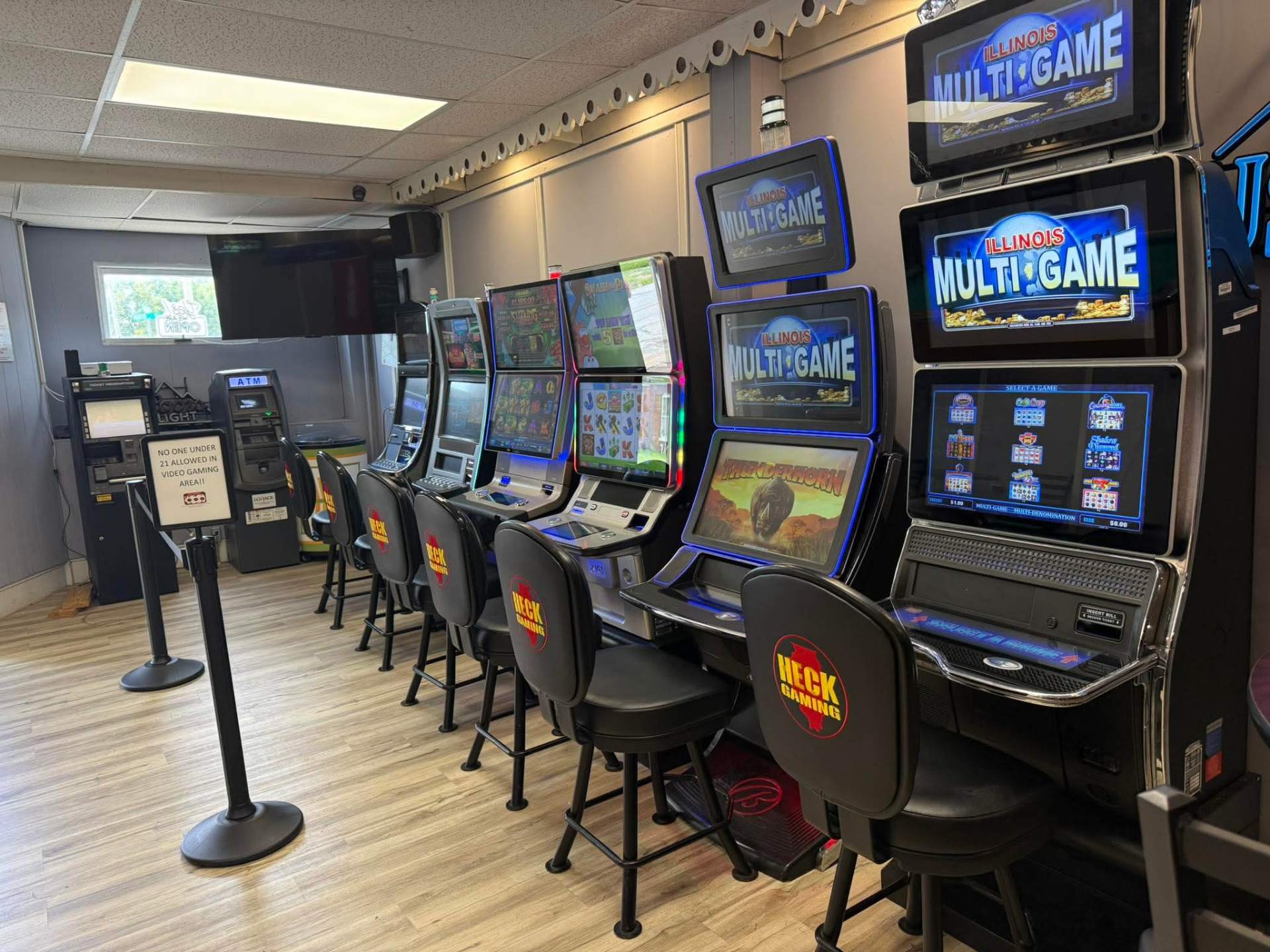 Row of Illinois Multi-Game video gaming terminals with Heck Gaming chairs